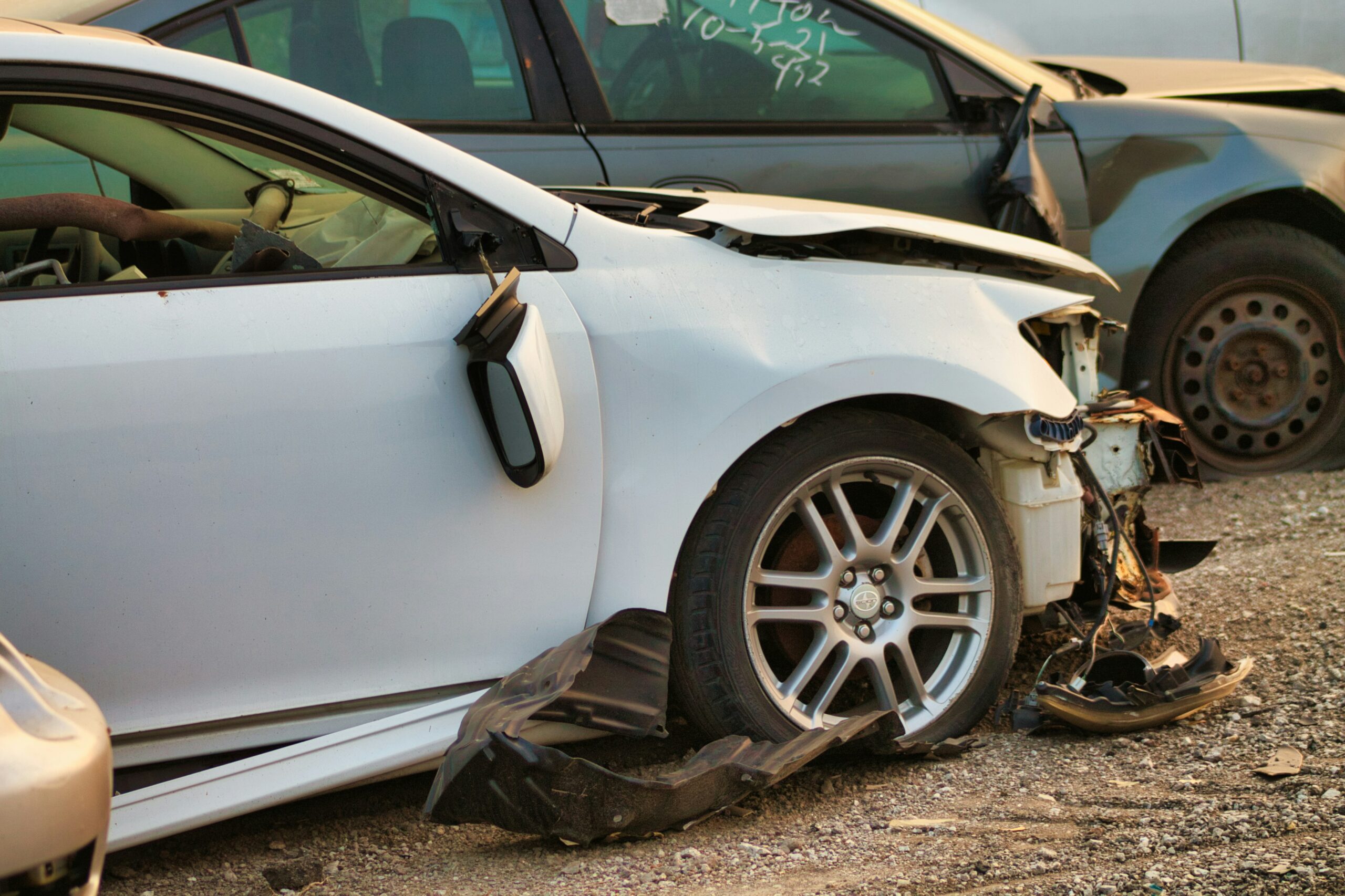 Close-up of a car showing damage related to auto injuries and non-surgical treatments.